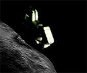 image of a spacecraft near an asteroid