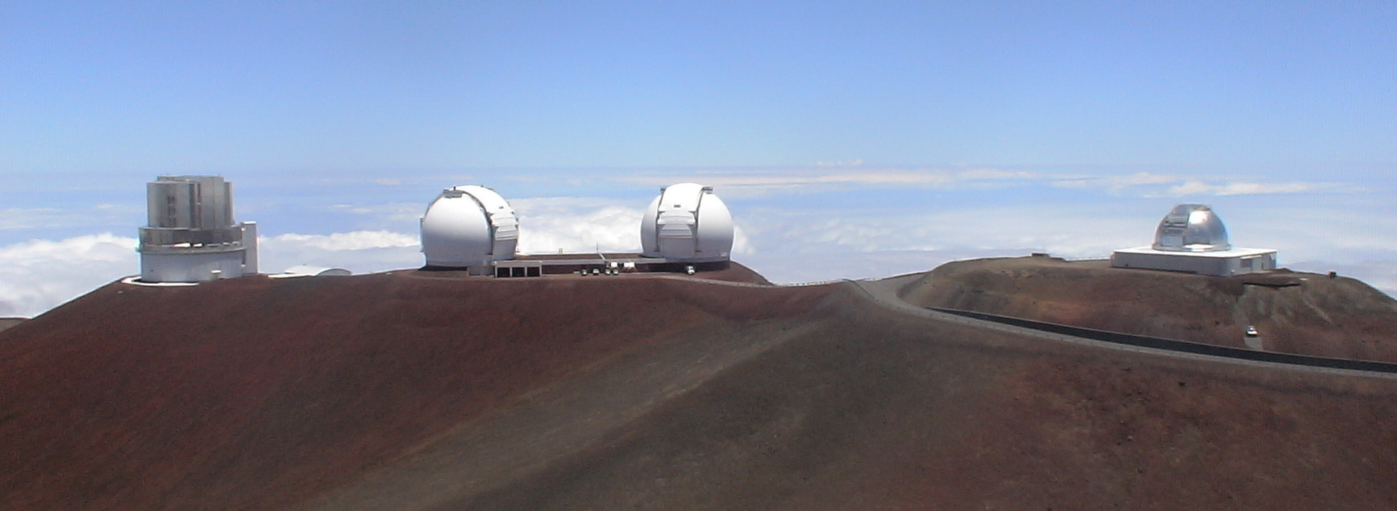 panoramic wide shot of irtf, keck, and subaru 
observatories on mauna kea hawaii