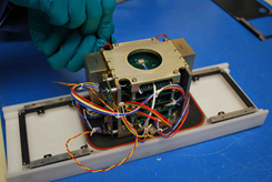 NASA Goddard-Built Instrument—Smallest of Its Kind—Provides Big Payback The smallest space weather spectrometer ever built, measuring just 3.5 X 3.5 inches square and 5 inches tall, was launched on board the ExoCube CubeSat in January 2015. The Mini Ion-Neutron Mass Spectrometer, or Mini-INMS, has provided some of the first direct measurements of particles in the upper atmosphere since the 1980s.